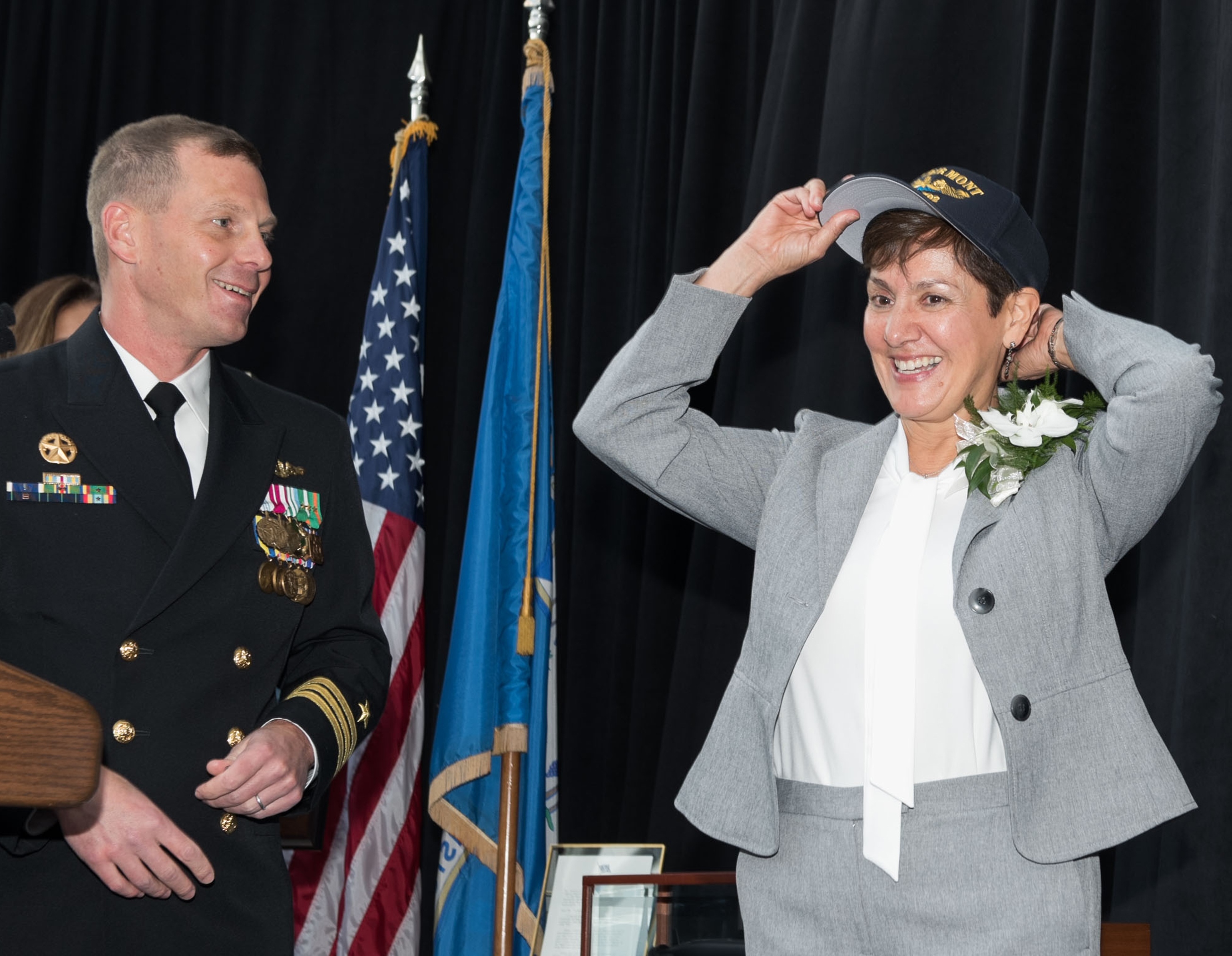 Gloria Valdez, ship sponsor of submarine Vermont, receives PCU Vermont hat after the Christening